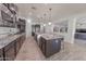 Modern kitchen with dark cabinetry, granite counters, and stainless steel appliances at 2835 E Athena Ct, Gilbert, AZ 85297