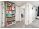 Hallway with built-in bookshelf and view into a play area at 2839 W Charleston Ave, Phoenix, AZ 85053