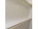 Simple walk-in closet with rod and shelf at 30039 N 209Th Ave, Wittmann, AZ 85361