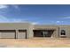 Modern home featuring a stucco exterior, covered porch, arched window, and convenient two-car garage at 30039 N 209Th Ave, Wittmann, AZ 85361