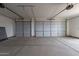 A spacious two car garage with two doors and a clean concrete floor at 30039 N 209Th Ave, Wittmann, AZ 85361