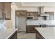 Contemporary kitchen featuring a large island, custom cabinetry, and open layout for easy entertaining at 30039 N 209Th Ave, Wittmann, AZ 85361