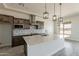 Well-equipped kitchen with a quartz island, stainless steel appliances, and stylish tile backsplash at 30039 N 209Th Ave, Wittmann, AZ 85361