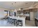Kitchen with large island, pendant lighting, stainless appliances, and breakfast bar seating at 30039 N 209Th Ave, Wittmann, AZ 85361