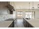 Modern kitchen with stainless steel appliances, stone countertops, stylish backsplash and an open design at 30039 N 209Th Ave, Wittmann, AZ 85361