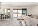 Spacious living area with large windows and access to backyard at 30039 N 209Th Ave, Wittmann, AZ 85361