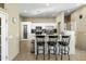 Kitchen with white cabinets, granite countertops, and breakfast bar at 35119 N 10Th St, Phoenix, AZ 85086