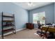 Home office with a desk, chair, and built-in shelving at 41356 W Jenna Ln, Maricopa, AZ 85138