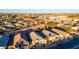 Aerial view of a suburban neighborhood with various houses and landscaping at 41844 W Rosa Dr, Maricopa, AZ 85138