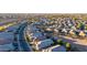 Aerial view showcasing a residential neighborhood with houses and streets at 41844 W Rosa Dr, Maricopa, AZ 85138