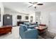Cozy basement recreation room features kitchenette and comfortable seating at 41844 W Rosa Dr, Maricopa, AZ 85138