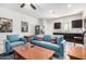 Spacious basement recreation room, kitchenette and comfy seating at 41844 W Rosa Dr, Maricopa, AZ 85138