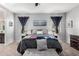 Main bedroom with plush carpet and ample natural light at 41844 W Rosa Dr, Maricopa, AZ 85138