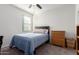 Bright bedroom with a comfortable bed and ample closet space at 41844 W Rosa Dr, Maricopa, AZ 85138