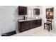 Dark wood cabinets and granite counters highlight this kitchenette at 41844 W Rosa Dr, Maricopa, AZ 85138