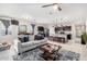 Open concept living room and kitchen with modern finishes at 41844 W Rosa Dr, Maricopa, AZ 85138