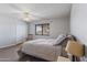 Bedroom with hardwood floors, a ceiling fan, and a rocking chair at 4932 E Calypso Ave, Mesa, AZ 85206