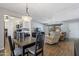 Dining area with kitchen views and a view into the living room at 4932 E Calypso Ave, Mesa, AZ 85206