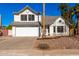 Two-story house with a white garage door and rock landscaping at 5416 E Glencove St, Mesa, AZ 85205