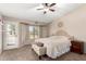 Bright and airy main bedroom with plush bedding and a private balcony at 5416 E Glencove St, Mesa, AZ 85205