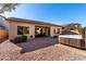Backyard with hot tub, patio, and desert landscaping at 5512 W Cavedale Dr, Phoenix, AZ 85083