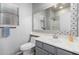 Bathroom with toilet, sink, and patterned mirror at 5512 W Cavedale Dr, Phoenix, AZ 85083