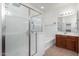 Bathroom boasts a shower, tub, and vanity with wood cabinets at 5512 W Cavedale Dr, Phoenix, AZ 85083