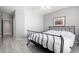 Bedroom with large bed, wood-look floors and neutral walls at 5512 W Cavedale Dr, Phoenix, AZ 85083