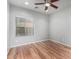 Spacious bedroom with wood-look flooring and ceiling fan at 5512 W Cavedale Dr, Phoenix, AZ 85083