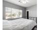 Bedroom with large window, white bedding and backyard view at 5512 W Cavedale Dr, Phoenix, AZ 85083