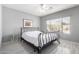 Bright bedroom with a ceiling fan, large window and wood-look floors at 5512 W Cavedale Dr, Phoenix, AZ 85083