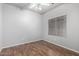 Simple bedroom with wood-look floors and a ceiling fan at 5512 W Cavedale Dr, Phoenix, AZ 85083