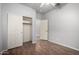 Bedroom with wood-look floors, closet and door to hallway at 5512 W Cavedale Dr, Phoenix, AZ 85083