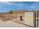 Fenced dog park with water fountain and rules posted at 5512 W Cavedale Dr, Phoenix, AZ 85083