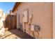 Home's exterior featuring a side gate, meter box, and stucco wall at 5512 W Cavedale Dr, Phoenix, AZ 85083