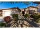 Single-story house with a two-car garage and desert landscaping at 5512 W Cavedale Dr, Phoenix, AZ 85083
