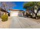 Single story home with a two-car garage and a long driveway at 5512 W Cavedale Dr, Phoenix, AZ 85083