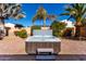 Relaxing hot tub on paved patio, surrounded by lush landscaping and palm trees at 5512 W Cavedale Dr, Phoenix, AZ 85083