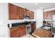 Well-equipped kitchen featuring dark wood cabinets at 5512 W Cavedale Dr, Phoenix, AZ 85083