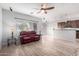 Open living room with a view of the kitchen and tile floors at 5512 W Cavedale Dr, Phoenix, AZ 85083