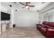 Bright living room featuring tile floors and a ceiling fan at 5512 W Cavedale Dr, Phoenix, AZ 85083
