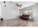 Spacious living room with tile flooring and a ceiling fan at 5512 W Cavedale Dr, Phoenix, AZ 85083