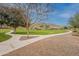 Concrete walking path meanders through grassy areas at 5512 W Cavedale Dr, Phoenix, AZ 85083