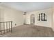 Spacious living room featuring neutral carpet and an archway at 5530 N 47Th Ave, Glendale, AZ 85301