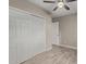 Bedroom with large closet and wood-look floors at 6443 E Alder Ave, Mesa, AZ 85206