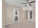 Spacious bedroom with ceiling fan and en-suite bathroom at 6443 E Alder Ave, Mesa, AZ 85206