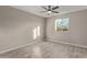 Bright bedroom featuring wood-look tile flooring and a ceiling fan at 6443 E Alder Ave, Mesa, AZ 85206