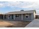 Remodeled home with covered porch and ample yard space at 6443 E Alder Ave, Mesa, AZ 85206