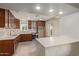 Updated kitchen with stainless steel appliances and stylish cabinetry at 6443 E Alder Ave, Mesa, AZ 85206