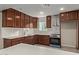 Bright kitchen with stainless steel appliances and ample counter space at 6443 E Alder Ave, Mesa, AZ 85206